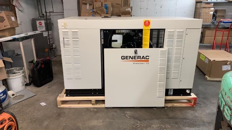 A Generac Protector QS standby generator on a pallet in the TSD Electric shop